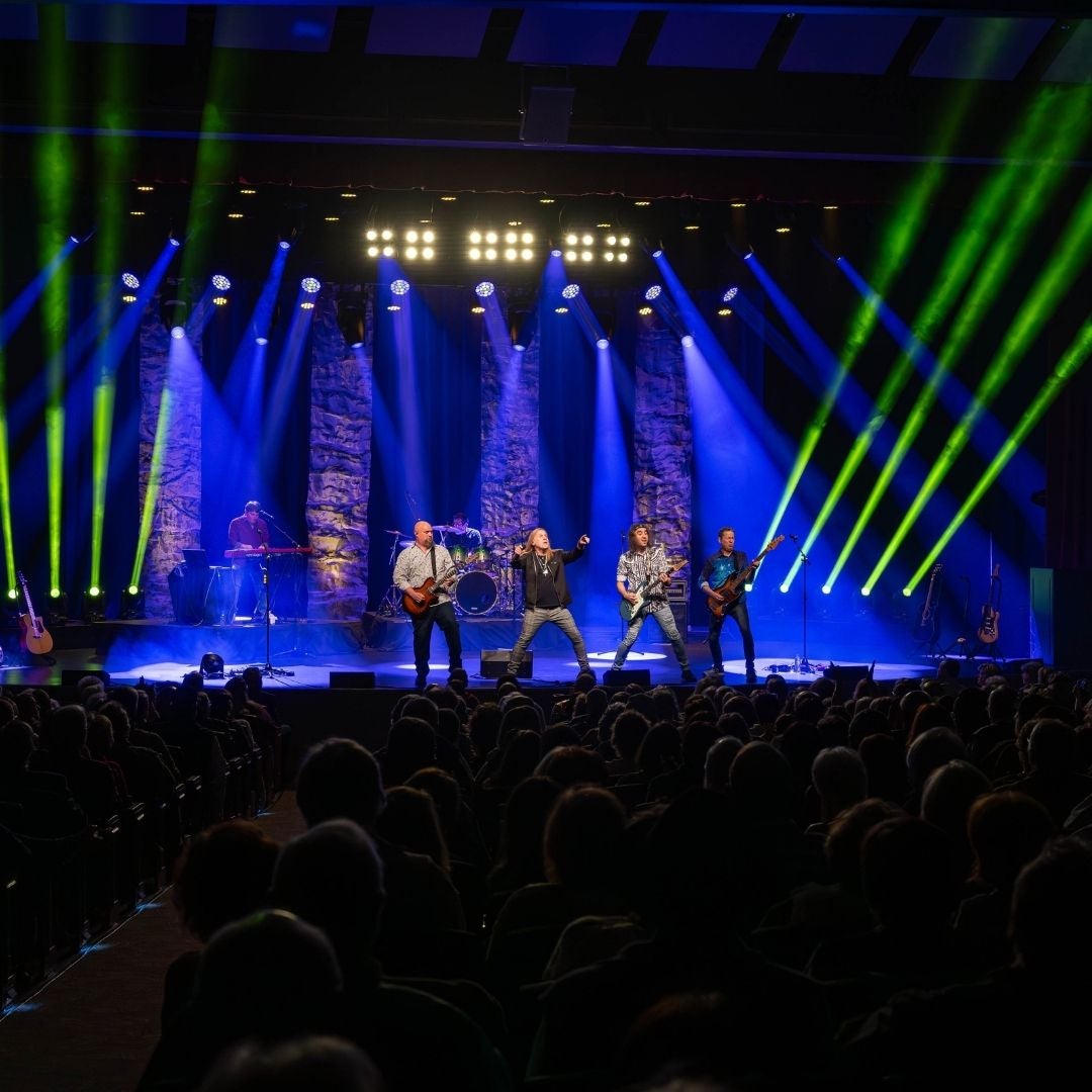 whole band up on stage with event lights