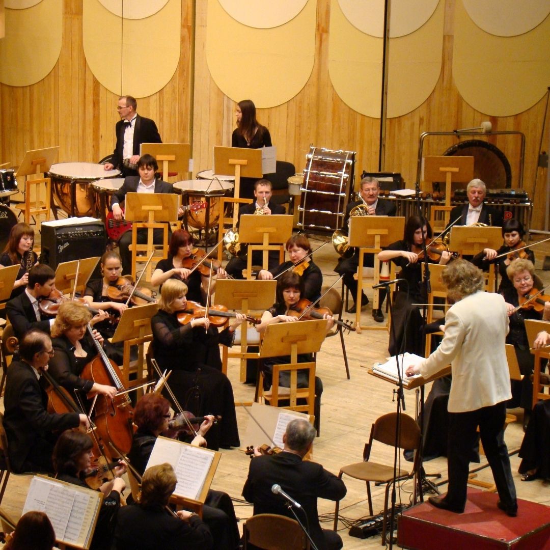 orchestra playing on a stage